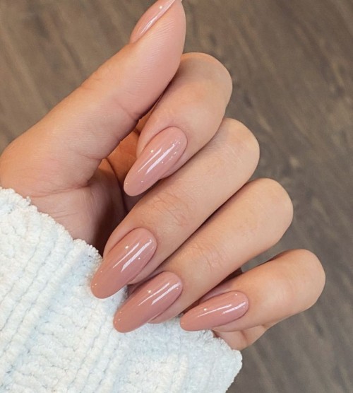 classic nude almond-shaped nails featuring a glossy finish