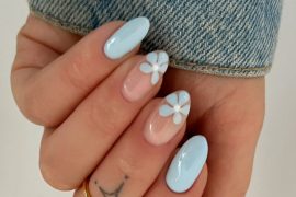 pastel blue almond nails and white flower nail art on sheer nude base