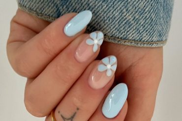 pastel blue almond nails and white flower nail art on sheer nude base