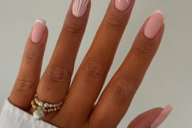Square pink nails with shell stripe art and 3D glitter starfish accent