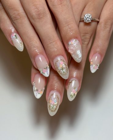 Romantic bridal nails with pastel florals, pearls, and gold accents—perfect for weddings, engagements, or any soft glam occasion.