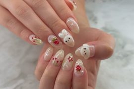 Almond-shaped jelly nude nails with 3D bunny and strawberry design