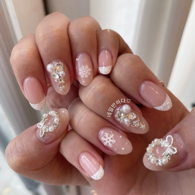 3D Nail Art Tutorial: winter pink gel nails with glittery French tips, snowflakes, and pearl wreaths with crystals