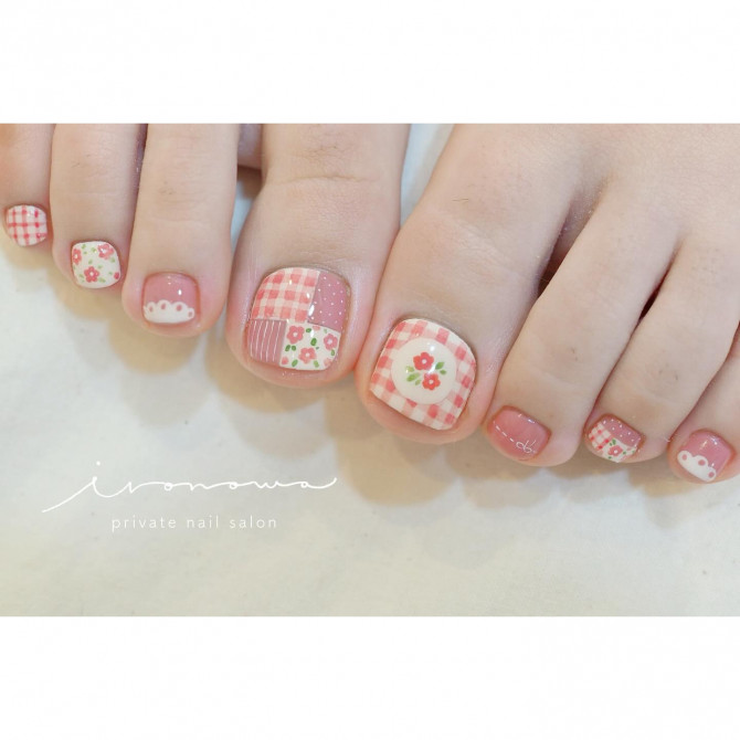 Pink gingham toenail art with mini florals, polka dots, clouds, and patchwork quilt design