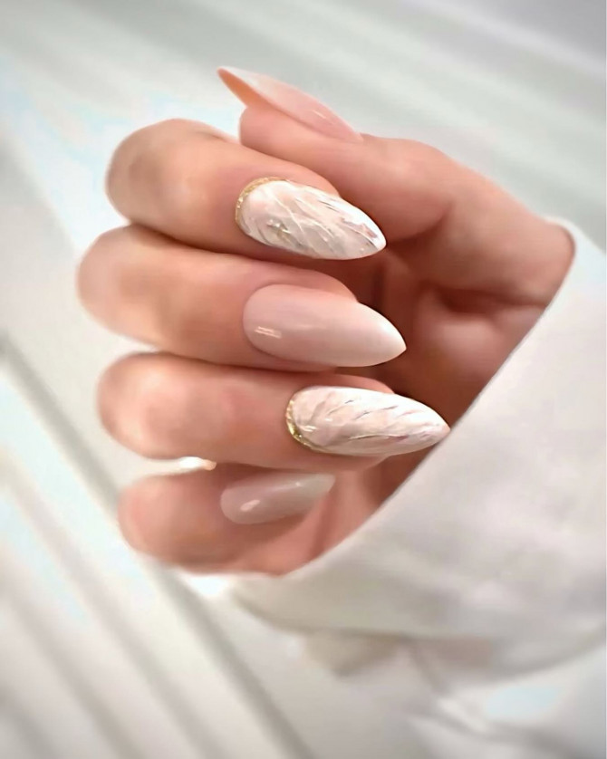 nude almond nails with chrome silver accents and minimal design