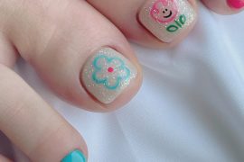 Glitter nude toenails with pink bear and aqua flower design, paired with vibrant turquoise and pink accents