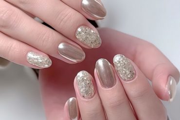 gold chrome nails with chunky glitter accents in oval shapeelegant and playful nail designs with nude tones and gold foil