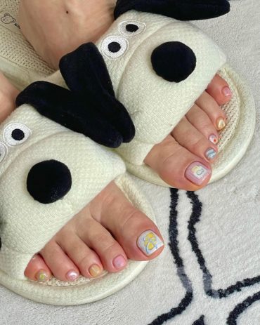 Toe nails with lemon slice and iced drink designs, polished in pastel shimmer tones with short square shape