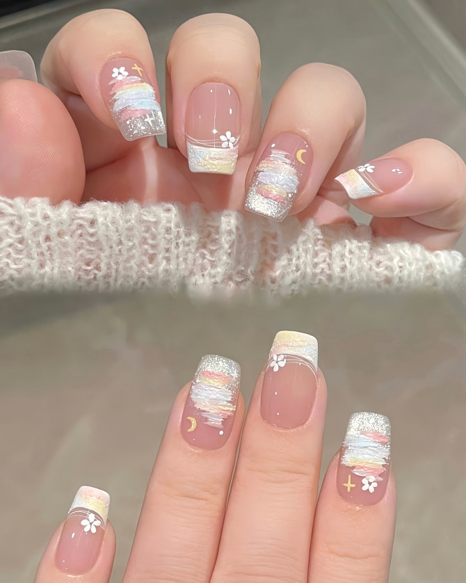 Pastel cloud-themed square nails with glitter and celestial motifs