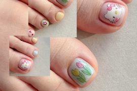 Pastel toe nails featuring Hello Kitty face, tulip flower art, and soft-colored polish with floral accents