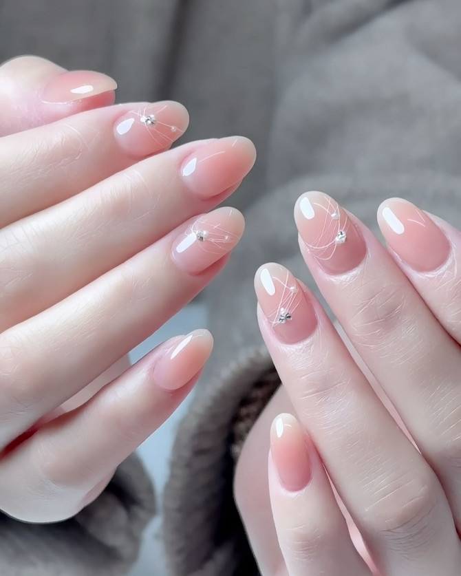 Romantic bridal ombré nails in soft peach with crystals and fine white line details