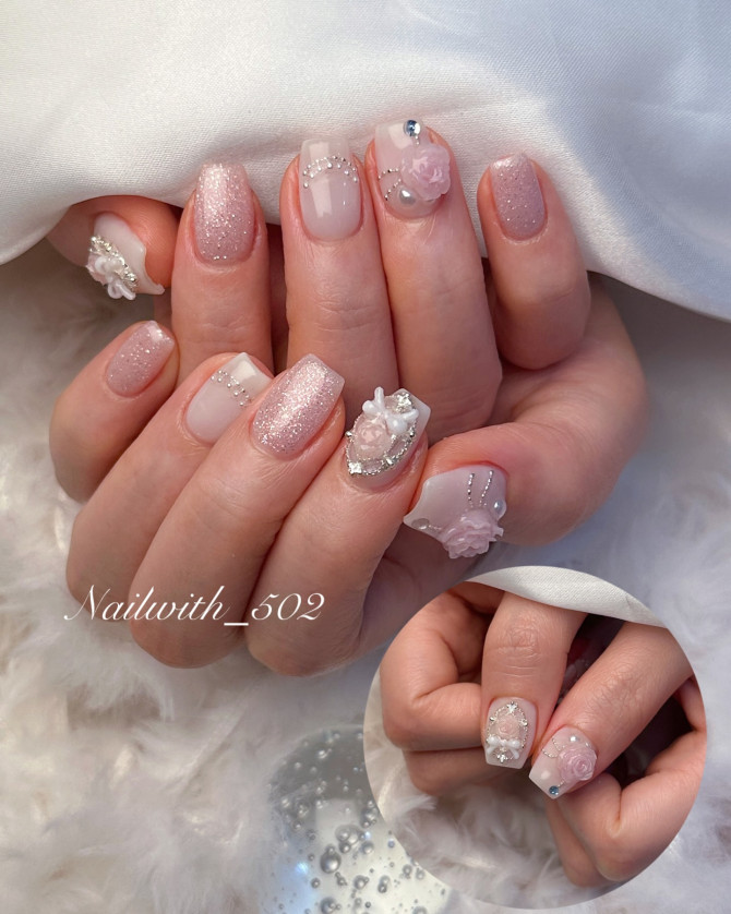Square bridal nails with pink glitter, 3D roses, pearls, and rhinestones—luxurious and romantic design for wedding elegance. 