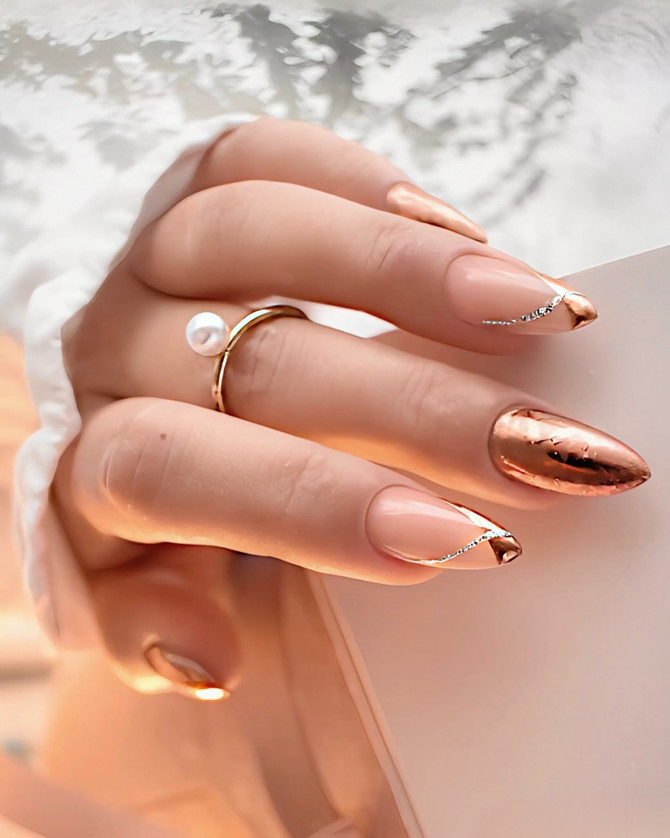 almond nude nails with rose gold foil tips and silver crystal accentselegant and playful nail designs with nude tones and gold foil