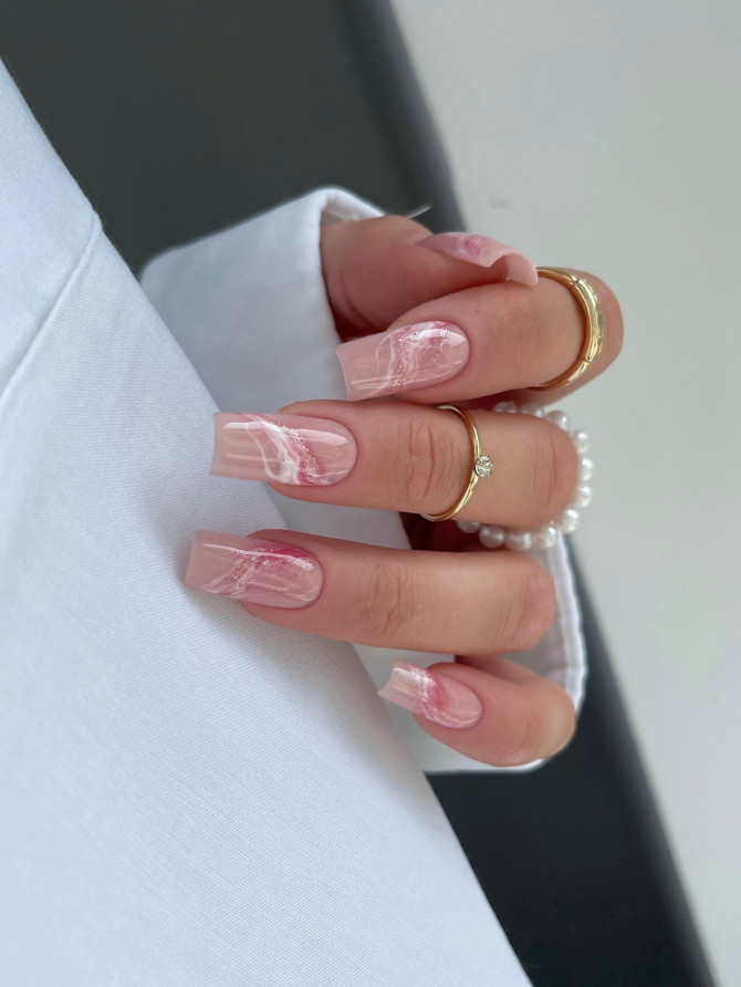Light pink nude nails with white marble swirl art on square tips for summer