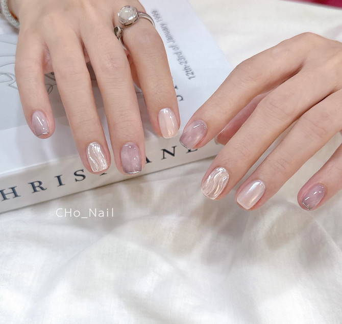 Short nude nails with 3D wave designs and translucent soft beige tones for summer