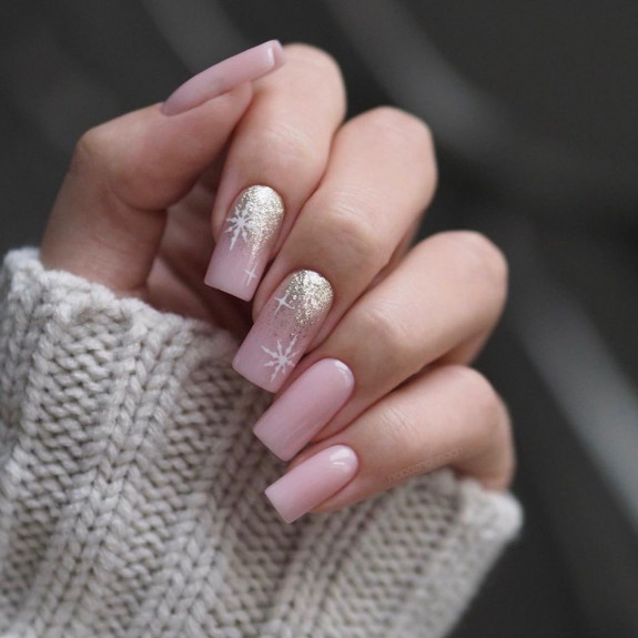 Long nude nails with gold glitter cuffs and starburst white accents for summer evenings
