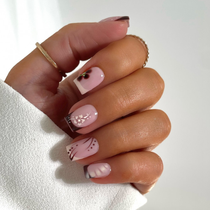 White floral French tip almond nails with pearl flower accents