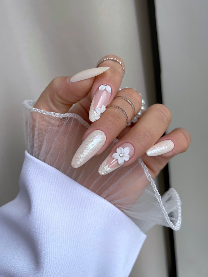 Nude nails with 3D floral details and shimmer