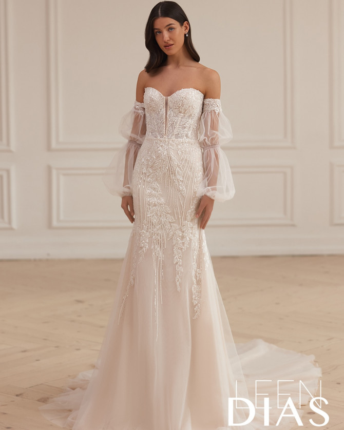Wide-strap bridal gown with unique neckline and pleated skirt