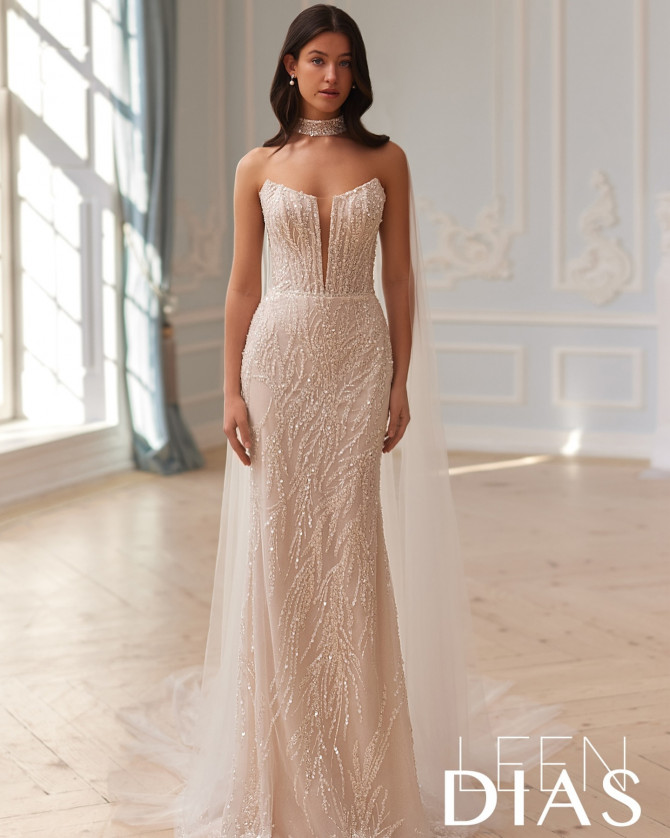Bride in glossy satin mermaid silhouette gown. Glossy mermaid silhouette modern bridal gown