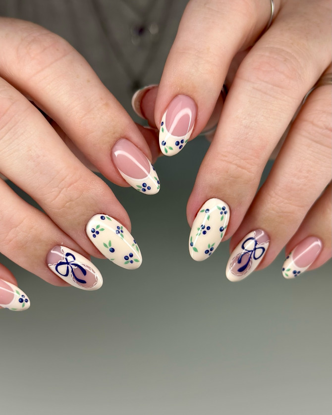  blueberry nail designs with cream base, blue bows, and French curves in cottagecore style
