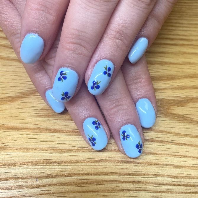  blueberry nail designs on baby-blue base with simple round shape and fruity accents