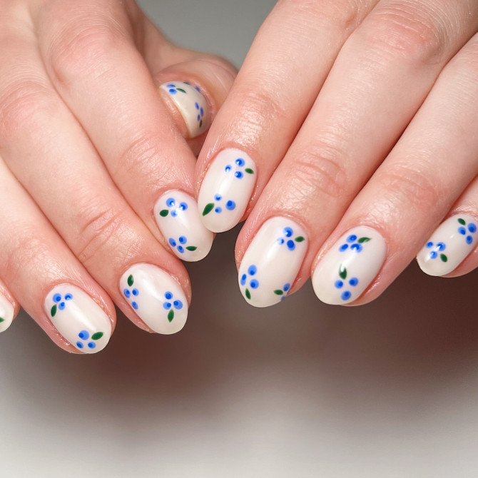 blueberry nail designs on off-white base with simple hand-painted berry accents