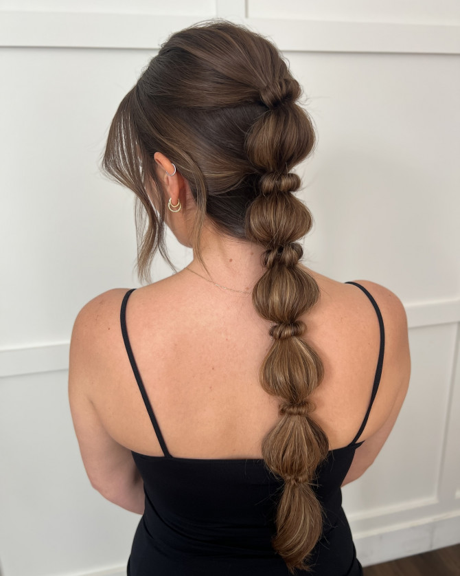 Boho-inspired bridal bubble ponytail with soft volume and loose face-framing pieces by @erikataftbridal. Soft long waves bridal hairstyle for romantic wedding” 