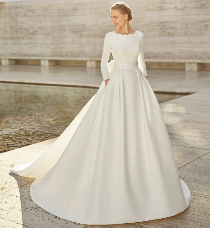 Bride in lace and tulle gown with soft floral detail