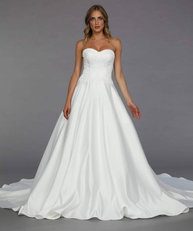 Bride in off-shoulder modern wedding dress with side drape Sweetheart satin gown with sleek silhouette