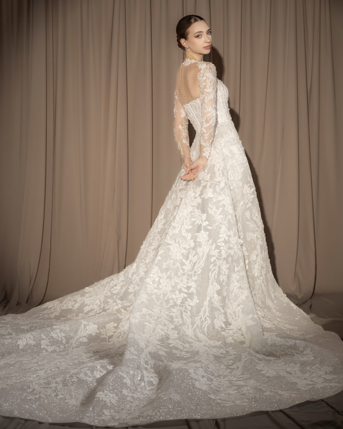 Bride in clean-cut straight white wedding dress with soft backdrop