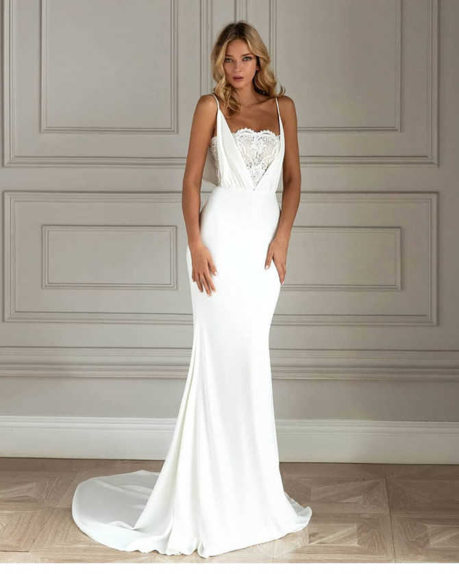 Bride in asymmetrical satin mermaid bridal gown