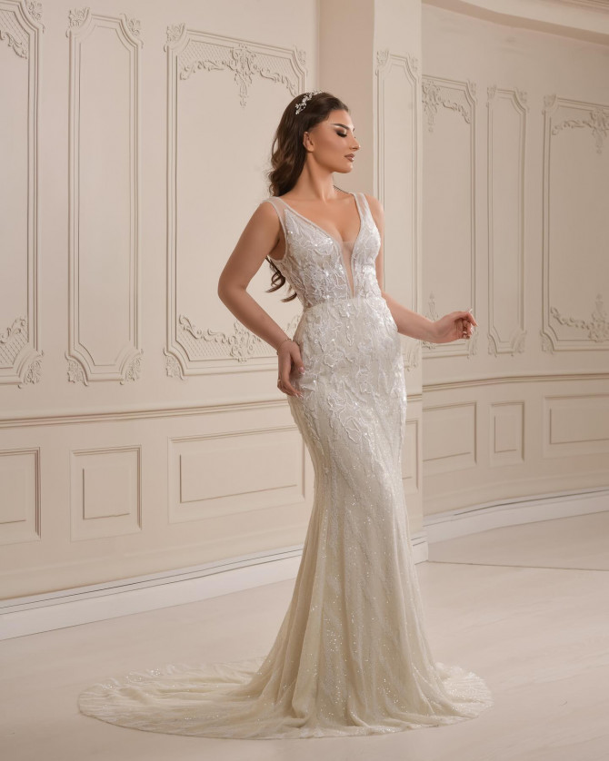 Bride in sequin embellished gown with sheer sleeves