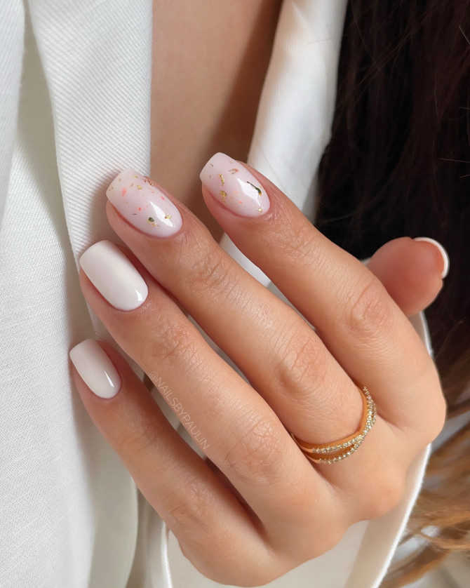 Soft pink shimmer nails with small daisy details