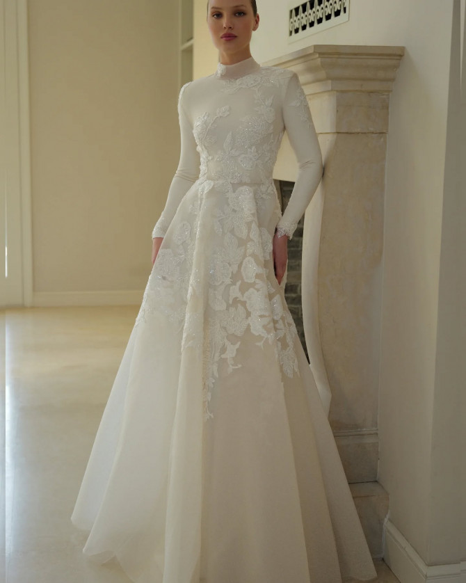 Bride in soft layered princess gown with pearly detail