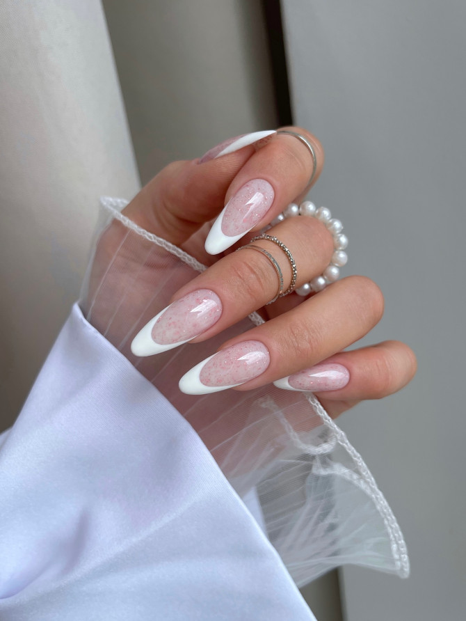 Soft speckled pink base with clean white French tips