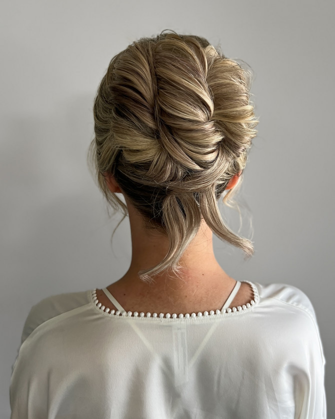 textured French twist bridal hairstyle with blonde highlights by @erikataftbridal