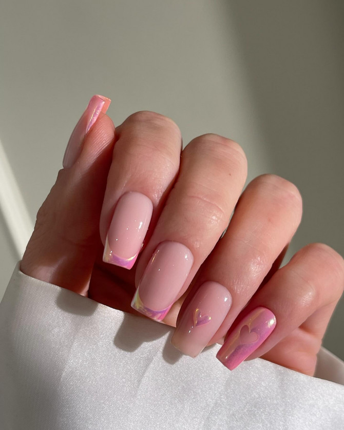 Square-shaped nude nails with pink iridescent French tips and soft heart accents—ideal for brides seeking a romantic and modern touch.