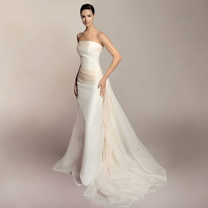 Bride in sleek strapless wedding gown with straight neckline