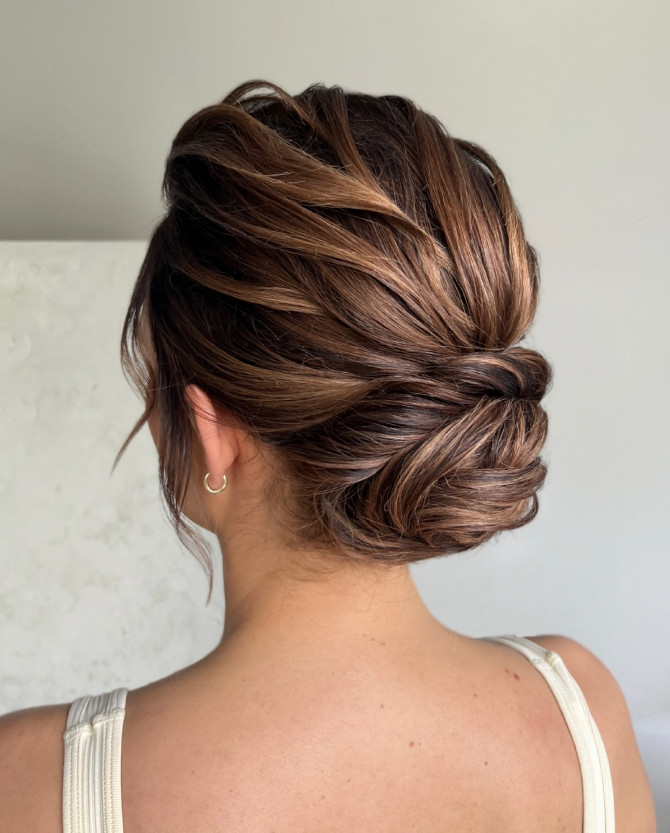  Dimensional brunette bridal low twist with soft volume and layered texture by