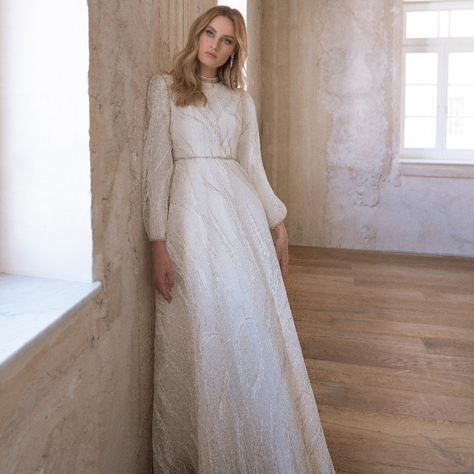 Bride in strapless couture wedding gown with floral beadwork