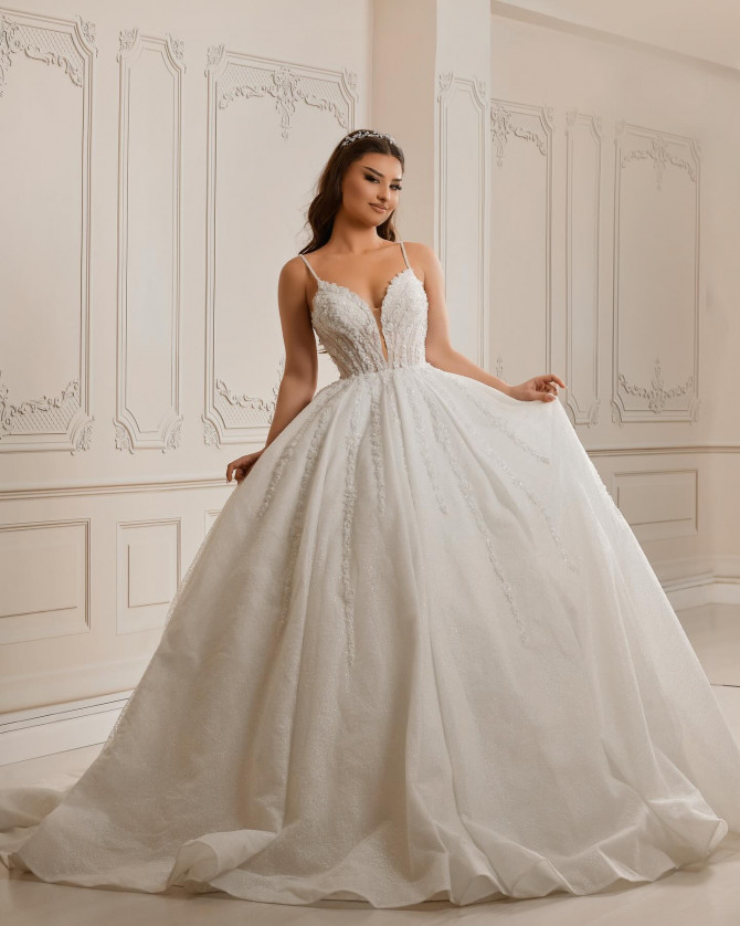 Bride in corseted glitter wedding dress with fairytale style