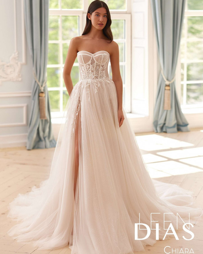 Bride in lace high-neck bridal gown with sheer sleeves