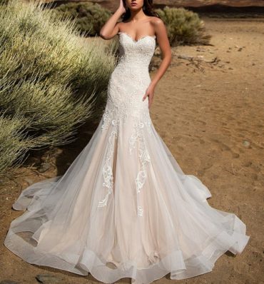 Bride in floral lace dress with sweetheart neckline.