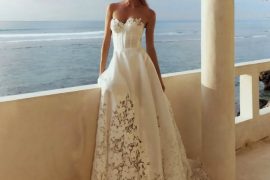 Bride in modern & sleek bridal gown with strapless sculpted silhouette