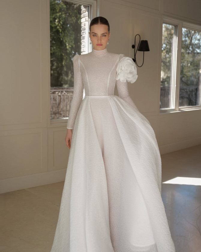 Bride in unique necklines bridal gown with cape sleeves