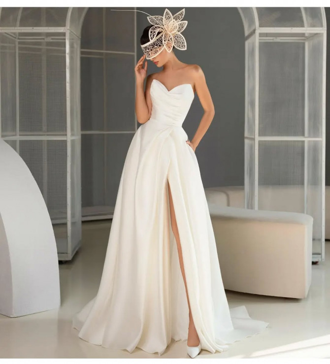 Bride in V-neck lace wedding dress with cap sleeves