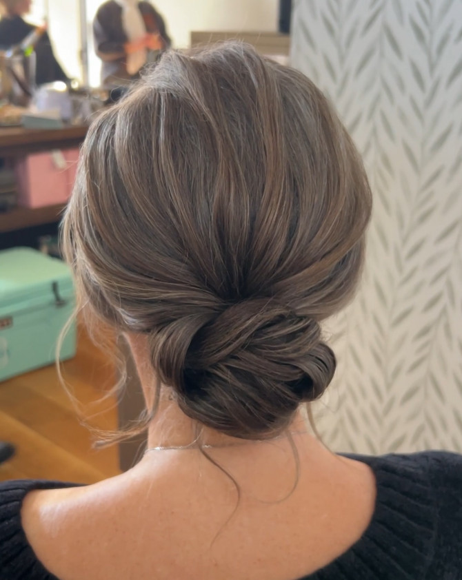 Soft Textured Low Bun with Natural Volume bridal hairstyle
