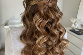 Golden caramel half-up bridal hairstyle with twisted crown and voluminous curls by @erikataftbridal. Romantic bridal hairstyle with caramel curls and twisted crown”