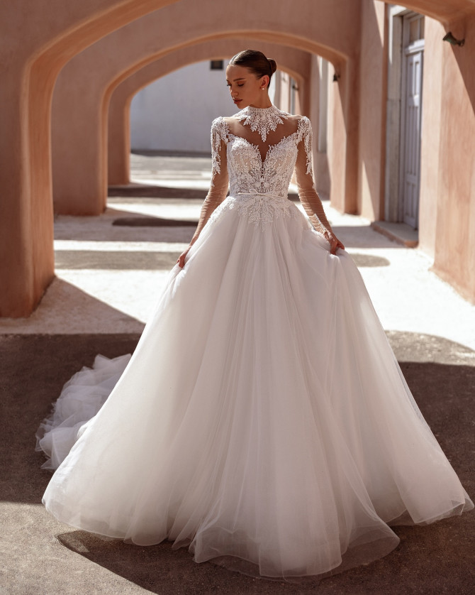 Minimalist satin wedding gown with clean lines and subtle train.Timeless Bridal Gowns with lace details